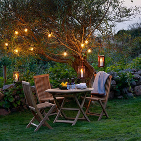 Viken Dining Chairs and Table with Marstrand Candle Lanterns by Skargaarden