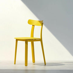 Vitra All Plastic Chair Buttercup Yellow by Jasper Morrison in Sunlight