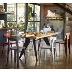 Vitra All Plastic Chairs by Jasper Morrison in room with Prouvé EM Table and Standard Chair