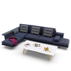 Vitra Antonio Citterio Grand Sofá in Midnight Blue in Situ with Color Block Blanket and Coffee Table