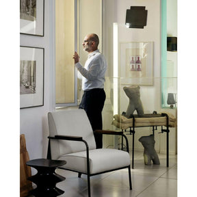 Vitra Prouvé Fauteuil de Salon Chair in room with Hocker Stool and Art