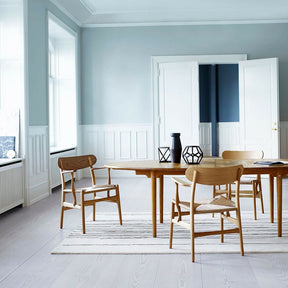 Wegner CH26 Dining Chairs Walnut and Oak in Dining Room with  Naja Utzon Popov Woodlines Rug