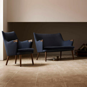 Wegner CH72 Sofa and CH71 Chair in Walnut with Dark Blue Canvas Styled in Room Carl Hansen and Son