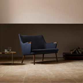 Wegner CH72 Sofa Dark Blue with Walnut Base styled in room